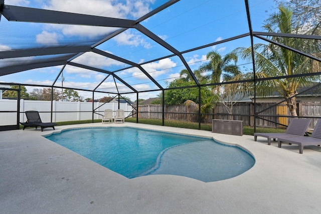 view of swimming pool with a patio and glass enclosure