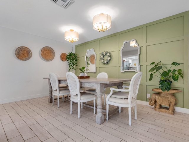 dining space featuring light wood-type flooring