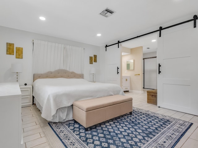 bedroom featuring a barn door