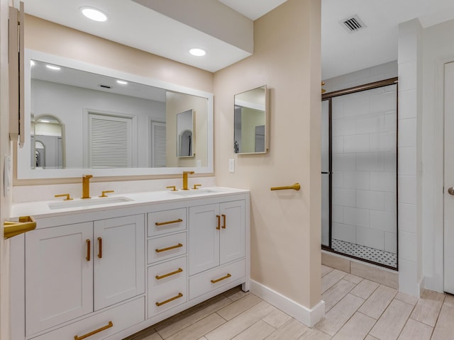 bathroom featuring walk in shower and vanity