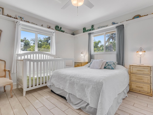 bedroom featuring multiple windows and ceiling fan