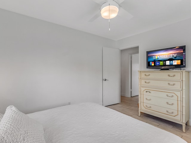 bedroom featuring ceiling fan and light hardwood / wood-style floors