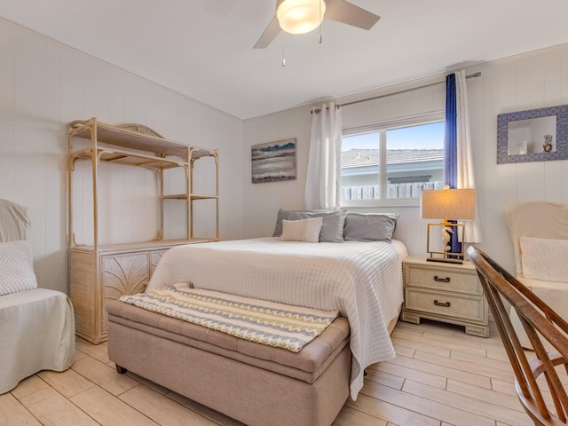 bedroom featuring light hardwood / wood-style flooring and ceiling fan