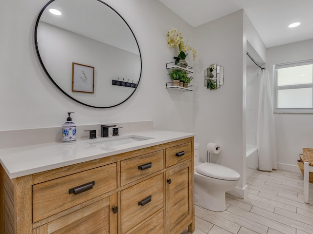 full bathroom featuring vanity, toilet, and shower / bath combo with shower curtain