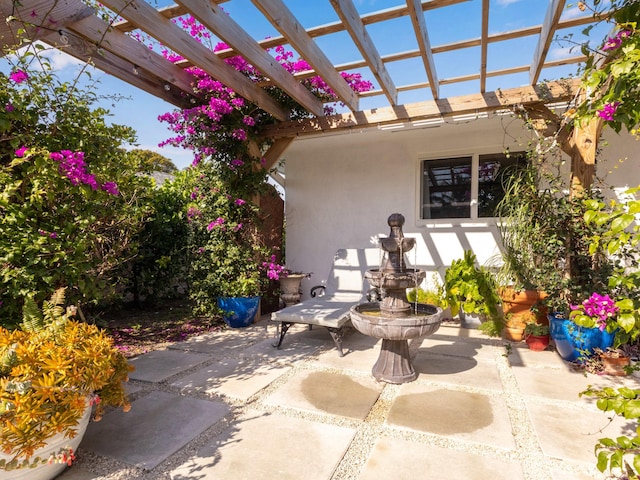 view of patio featuring a pergola