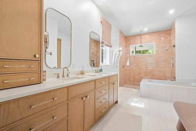 bathroom featuring vanity, tile patterned flooring, and independent shower and bath