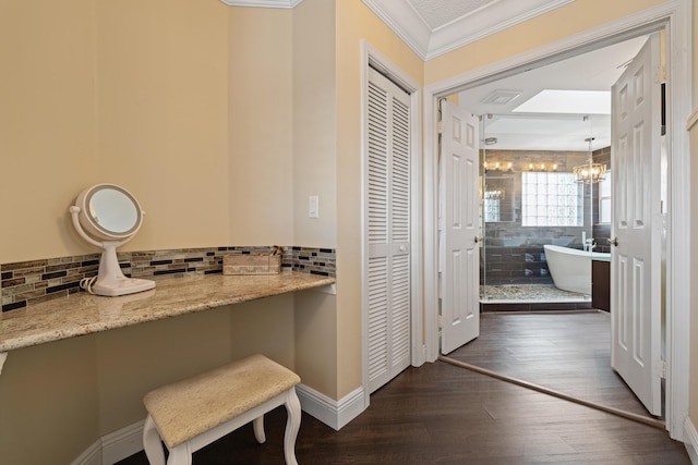 interior space with ornamental molding, dark hardwood / wood-style flooring, and a notable chandelier