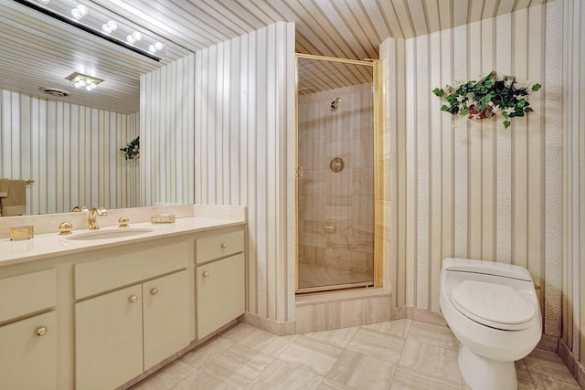 bathroom featuring vanity, an enclosed shower, tile patterned floors, and toilet