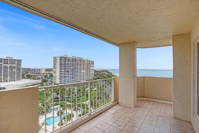 balcony featuring a water view