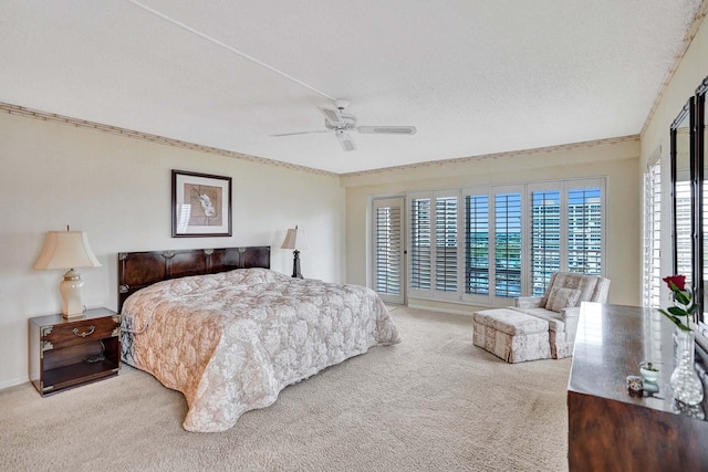 bedroom with ceiling fan, light carpet, and a textured ceiling