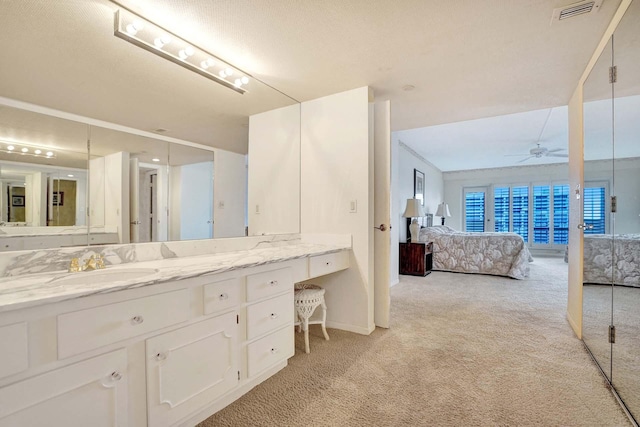 bathroom featuring vanity and ceiling fan