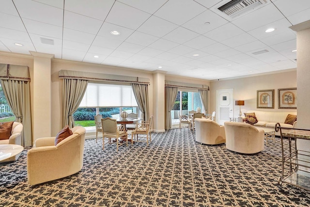 carpeted living room featuring crown molding