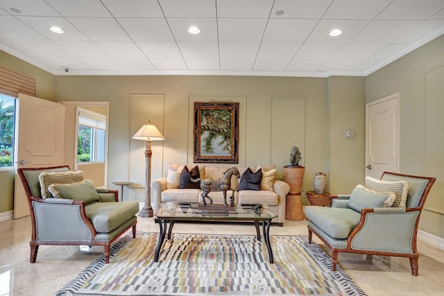 living area with crown molding