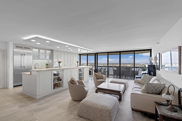 1900 Consulate Pl Unit 1902, West Palm Beach, FL 33401 - living room featuring floor to ceiling windows and sink