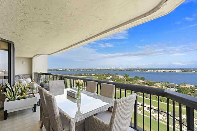 balcony featuring a water view