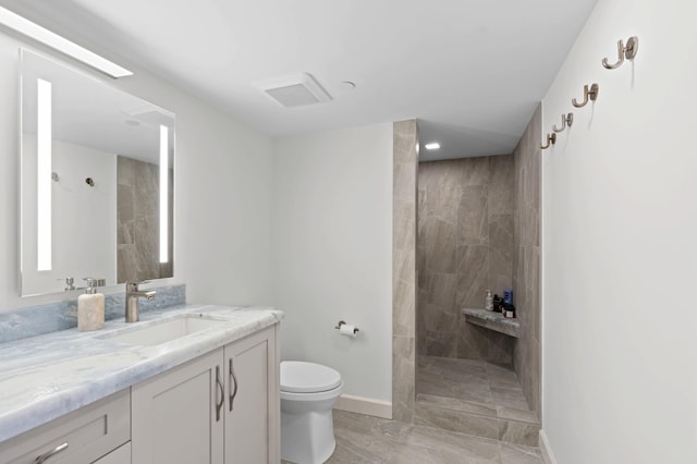 1900 Consulate Pl Unit 1902, West Palm Beach, FL 33401 - bathroom with vanity, toilet, and a tile shower