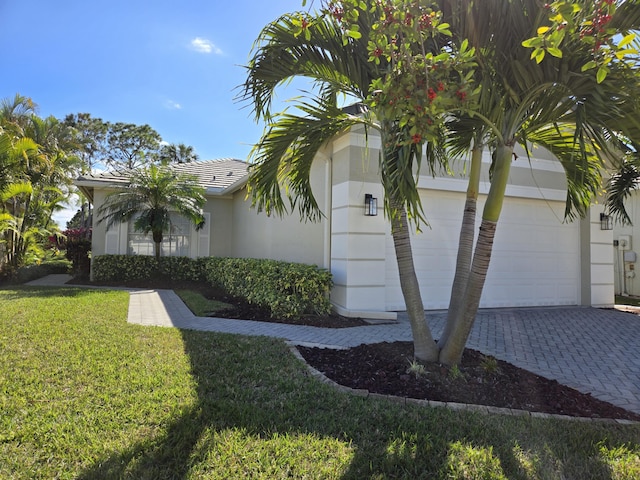 view of property exterior featuring a garage and a yard