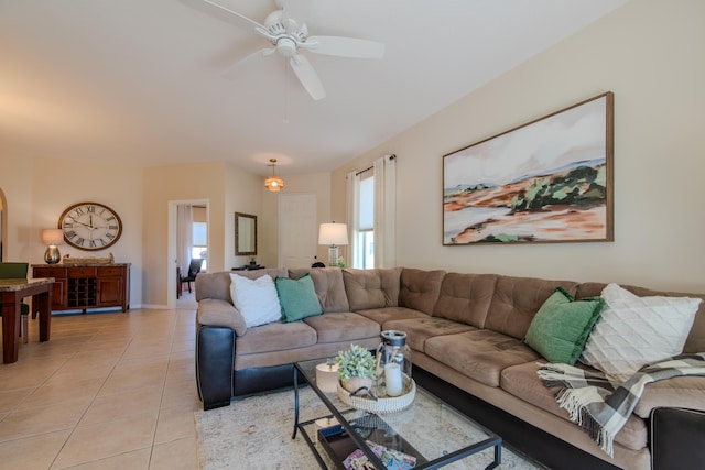 tiled living room with ceiling fan