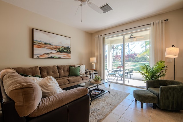 living room featuring ceiling fan and light tile patterned floors