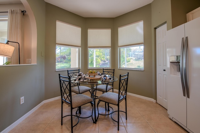 dining space with light tile patterned flooring