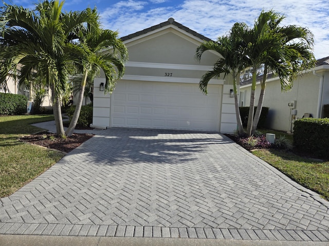 single story home featuring a garage