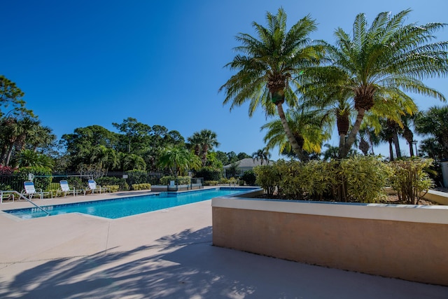 view of swimming pool with a patio area