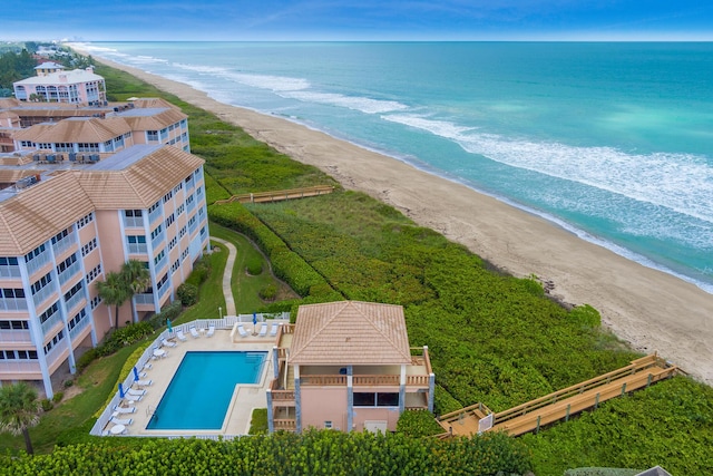 bird's eye view featuring a water view and a view of the beach