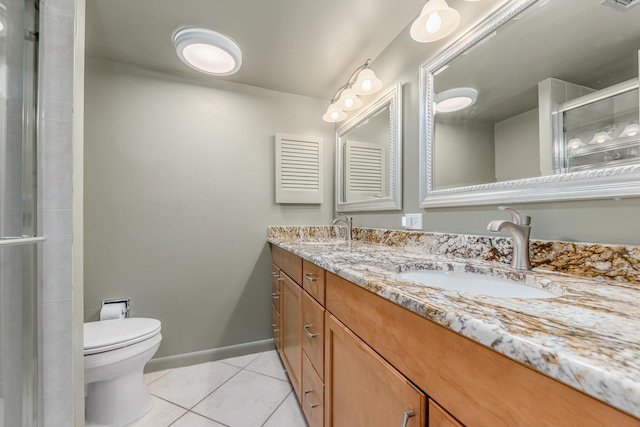 bathroom featuring walk in shower, tile patterned flooring, vanity, and toilet