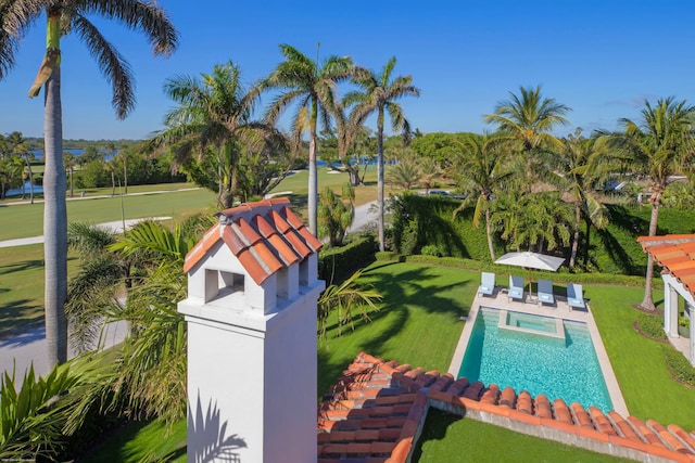 view of pool featuring a yard and a patio area