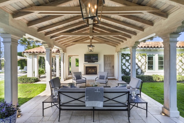 view of patio / terrace with a gazebo and an outdoor living space with a fireplace