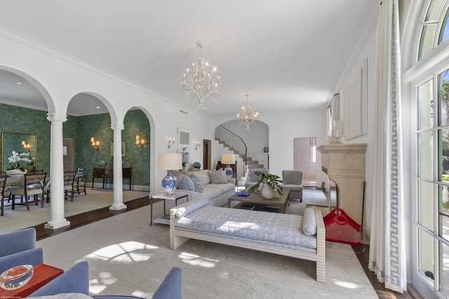 bedroom featuring ornate columns, crown molding, and a chandelier