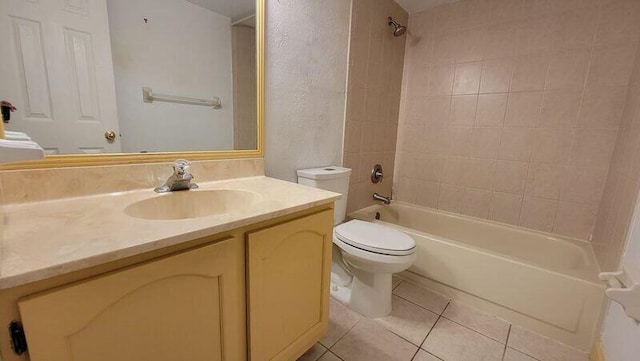 full bathroom with toilet, vanity, tile patterned floors, and tiled shower / bath