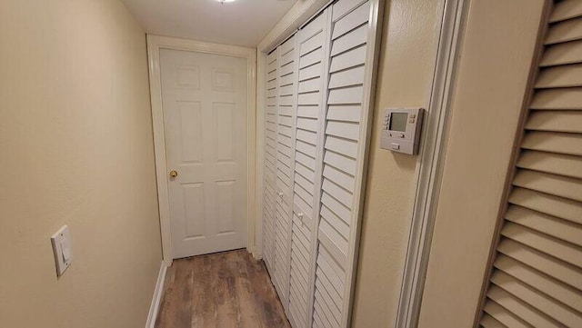 hallway featuring dark hardwood / wood-style floors