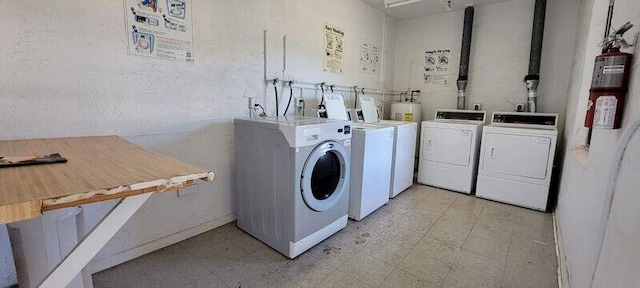 clothes washing area featuring washer and clothes dryer