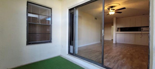 interior space featuring ceiling fan