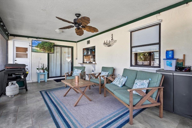 sunroom / solarium with ceiling fan