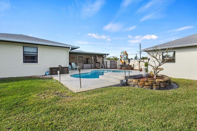 view of swimming pool with a lawn and a patio area