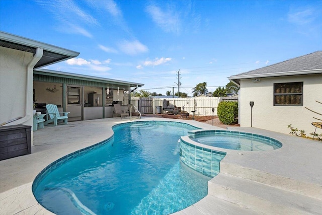 view of pool featuring an in ground hot tub and a patio