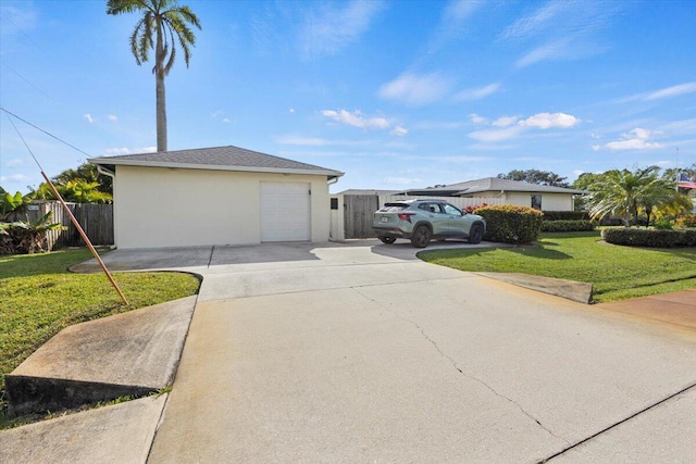 view of property exterior featuring a lawn and a garage