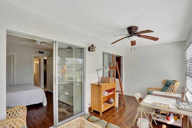 interior space with dark wood-type flooring and ceiling fan