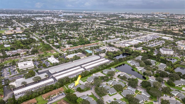 drone / aerial view with a water view