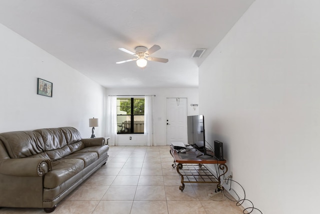 living room featuring light tile patterned floors and ceiling fan