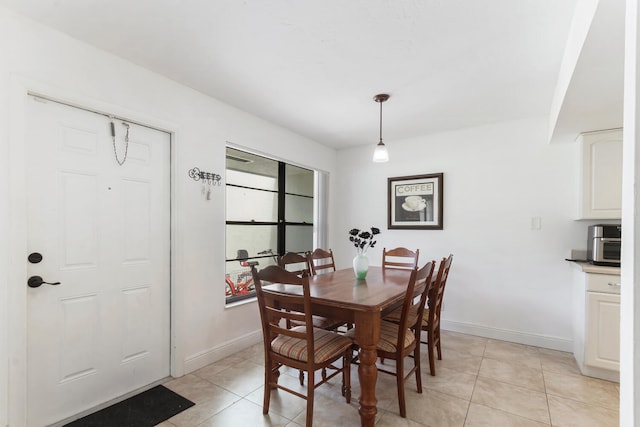 dining space with light tile patterned floors