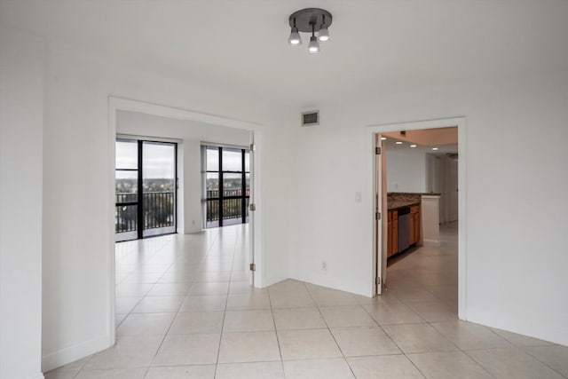 empty room with light tile patterned flooring