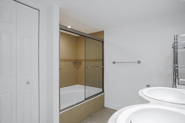 bathroom featuring combined bath / shower with glass door and tile patterned floors