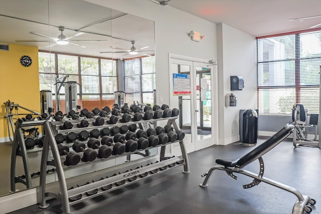 gym featuring ceiling fan and french doors