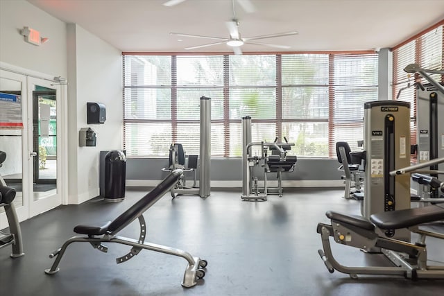 workout area with ceiling fan and french doors