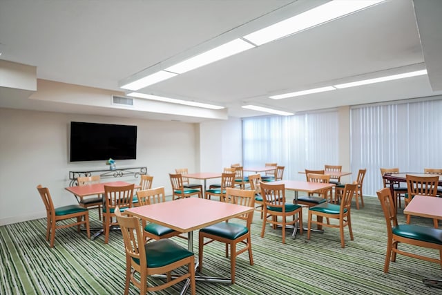 dining space with carpet floors