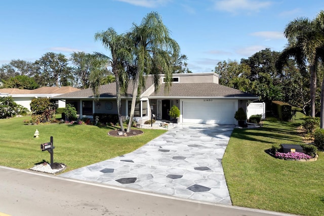 ranch-style home featuring a front yard and a garage