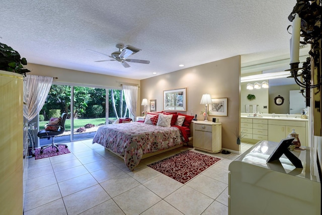 tiled bedroom with a textured ceiling, ceiling fan, and access to outside